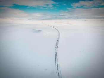 Aerial view of landscape against sky during winter