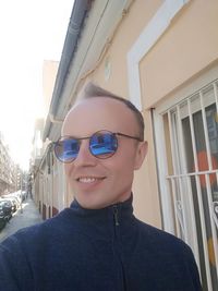Portrait of smiling man wearing sunglasses