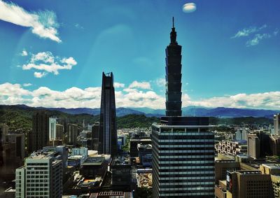 Modern buildings in city against sky