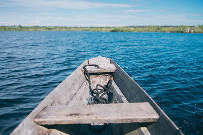 Boat on lake against sky