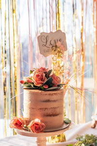 Close-up of birthday cake on glass