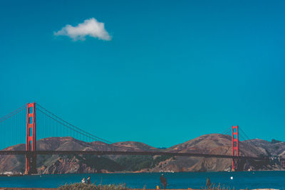 View of suspension bridge over sea