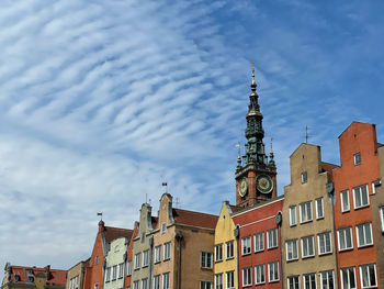 Low angle view of buildings in city against sky