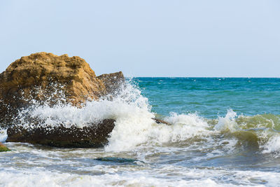 Scenic view of sea against clear sky