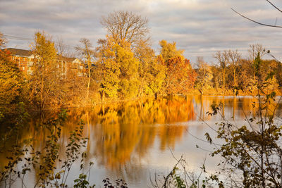 Scenic view of lake against sky during autumn