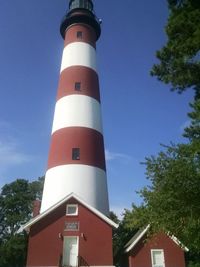 Low angle view of lighthouse against blue sky