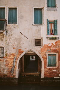 Entrance of old building by canal