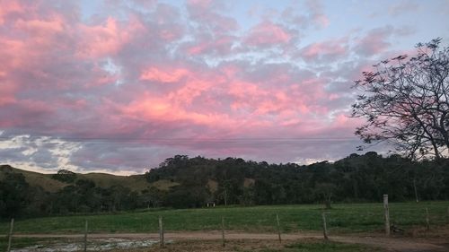 Scenic view of landscape against cloudy sky