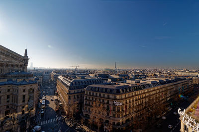 High angle view of city buildings against sky