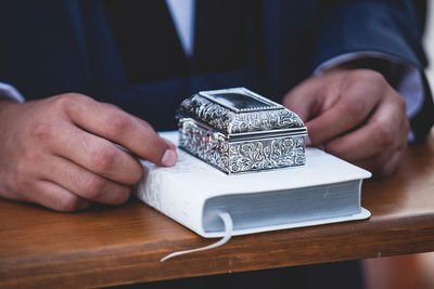 Close-up of man hand on table