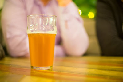 Glass of beer on table