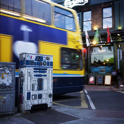 Blurred motion of bus on street in city at night