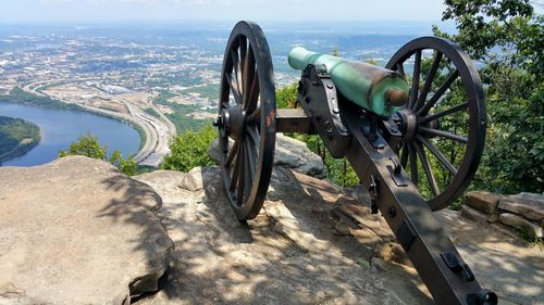 Panoramic shot of cannon wheel on cliff against sky. strategic advantage. 