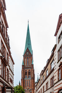 Low angle view of buildings against sky in city