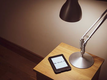High angle view of illuminated lamp on table at home