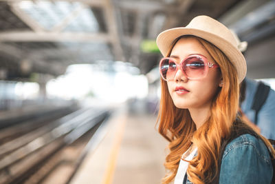 Portrait of young woman in sunglasses