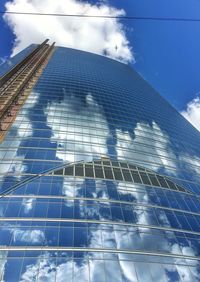 Low angle view of building against blue sky