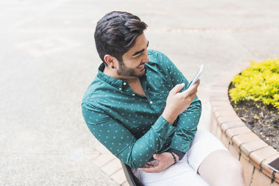 Young man using mobile phone