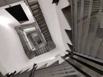 Directly below shot of spiral staircase of building