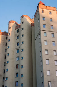 Low angle view of buildings against clear blue sky