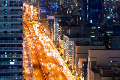 Illuminated modern buildings in city at night