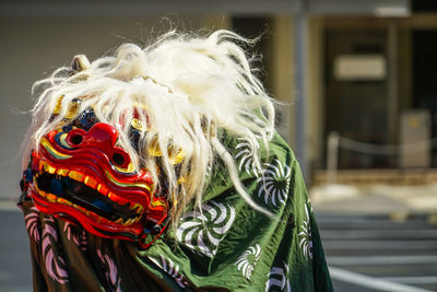 Rear view of woman with mask