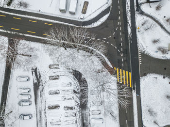 High angle view of snow covered cars in city