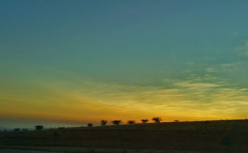 Scenic view of landscape at sunset