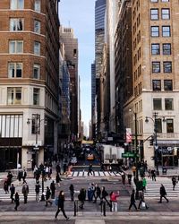 People walking on road in city