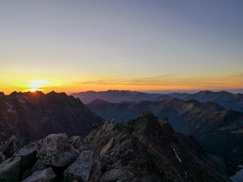 Scenic view of mountains against sky during sunset