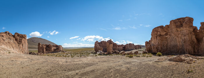 Rock formations in desert against sky