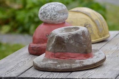 Close-up of wooden hats on table