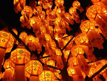 Low angle view of lanterns hanging at night