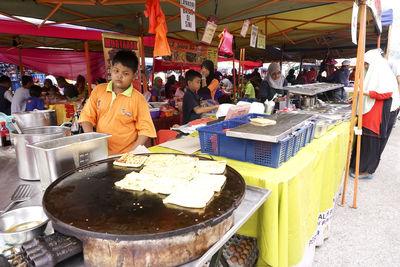 People at market stall