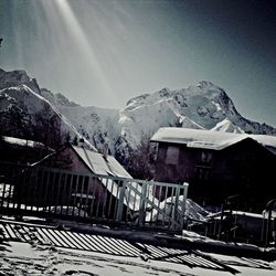 Scenic view of snow covered mountains against sky