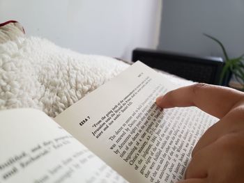 Close-up of hand holding book