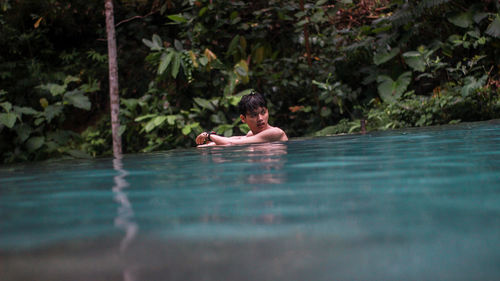Man swimming in pool