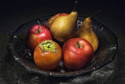 High angle view of apples in plate on table