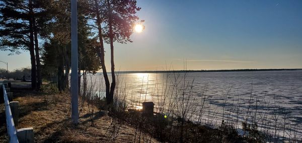 Scenic view of lake against sky during sunset