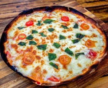 Close-up of pizza served on table