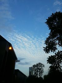 Low angle view of building against cloudy sky