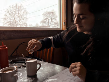 Young woman sitting at cafe