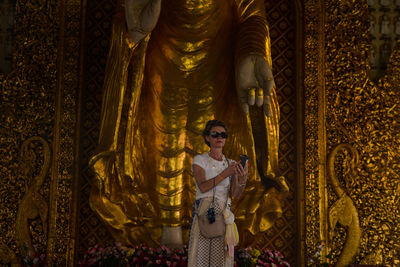 Woman standing in a temple