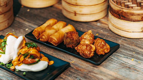 Close-up of serving food in plate on table