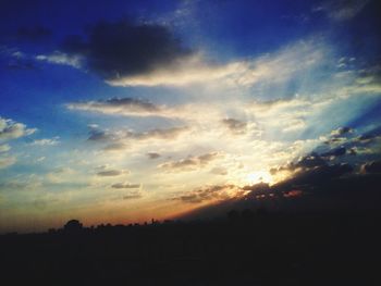 Scenic view of landscape against sky at sunset