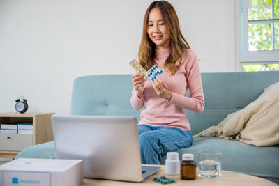 Young woman using mobile phone