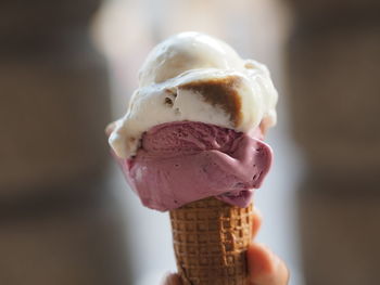 Cropped hand of person holding ice cream