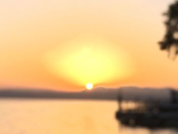 Scenic view of sea against orange sky