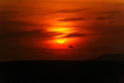 Scenic view of dramatic sky during sunset