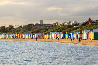 Scenic view of beach against sky in city